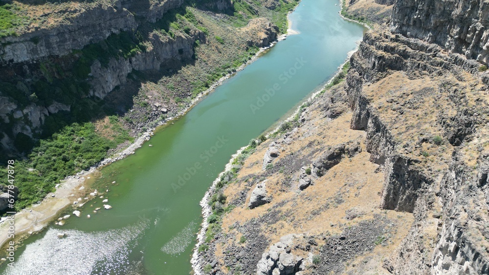 High-angle shot of rocky cliffs in the Shoshone Falls Park and the Snake River