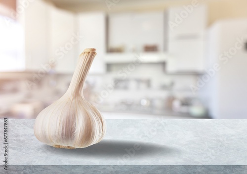 Garlic bulb unpeeled on the desk at kitchen photo