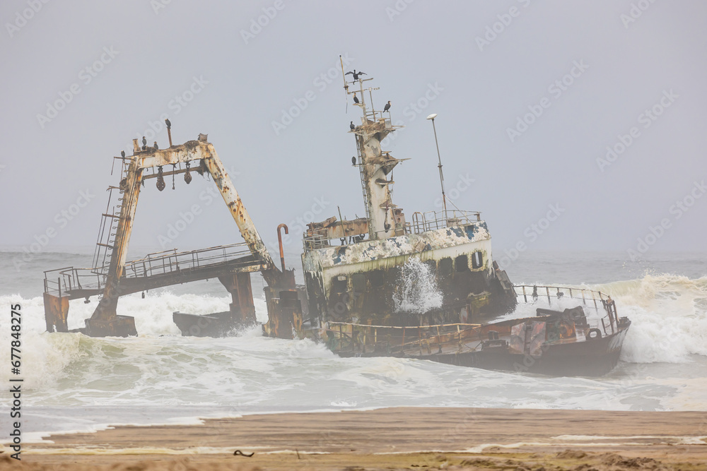Fototapeta premium Shipwreck Zeila in the crashing waves near Swakopmund on Namibia Skeleton Coast