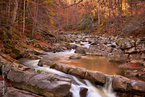 Obraz na płótnie autumn landscape with mountain river and silky waterfall w salonie