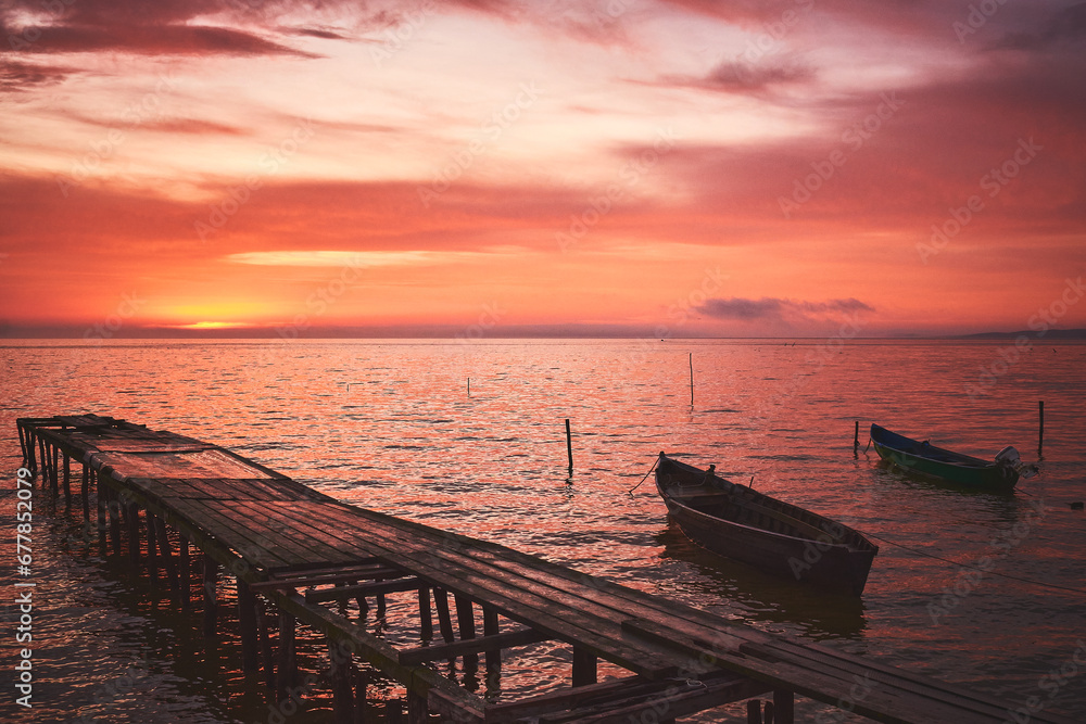 boat at sunrise on the lake