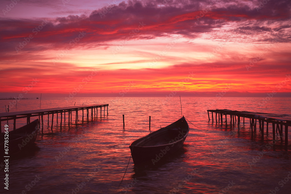 boat at sunrise on the lake