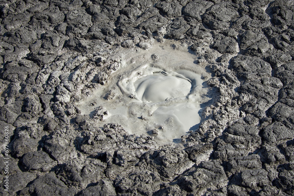 cones of mud volcanoes from which rivers of mud flow