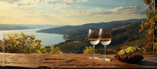 Wine positioned against the stunning backdrop of a landscape photo