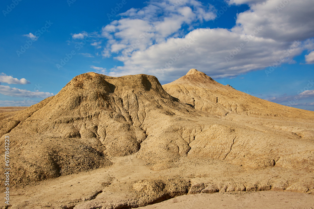 cones of mud volcanoes from which rivers of mud flow