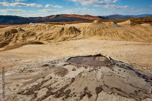 Obraz na płótnie cones of mud volcanoes from which rivers of mud flow w salonie