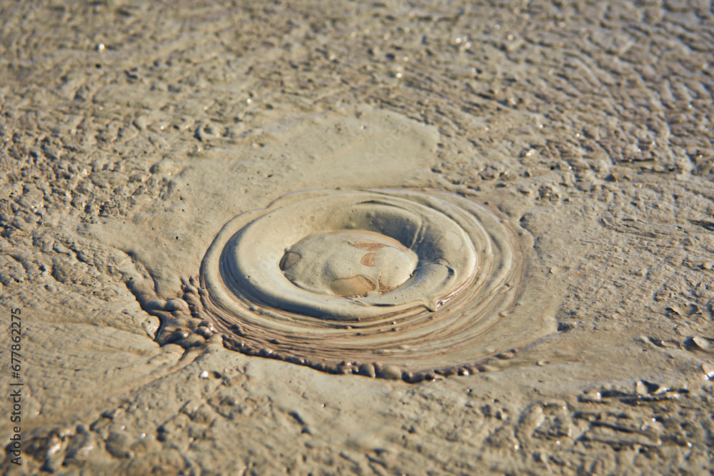 cones of mud volcanoes from which rivers of mud flow
