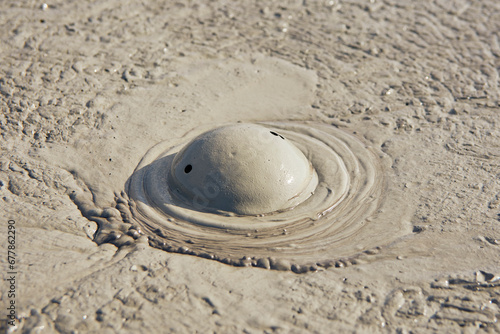 cones of mud volcanoes from which rivers of mud flow