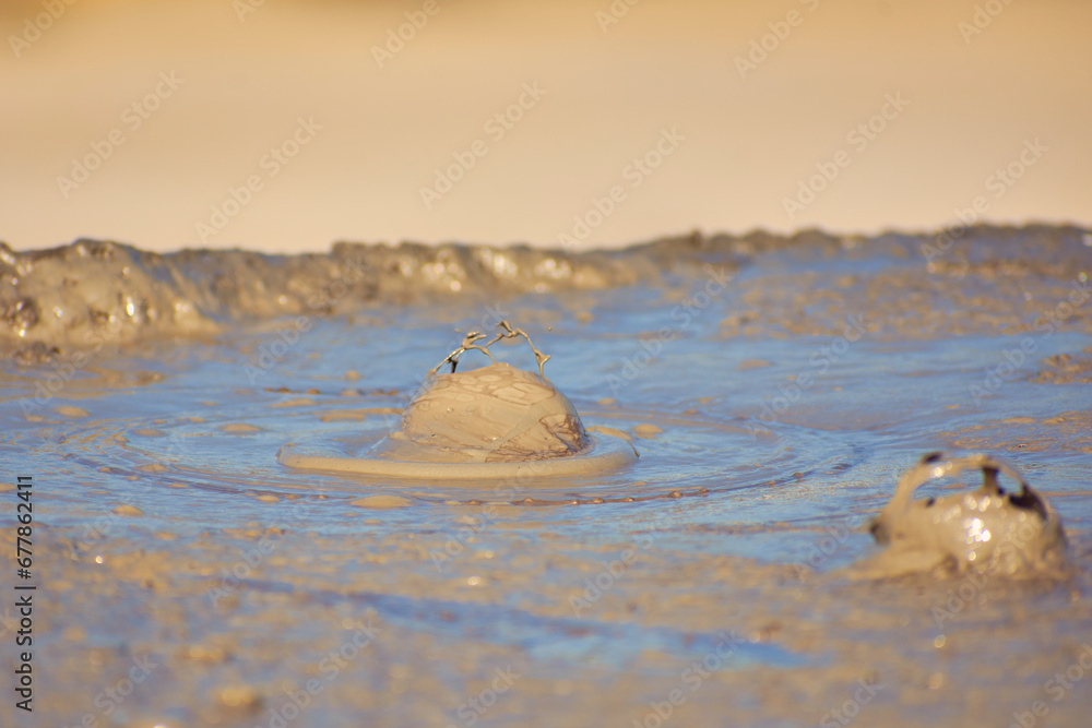 cones of mud volcanoes from which rivers of mud flow