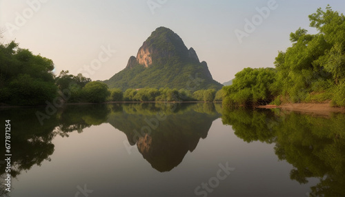 Tranquil scene of mountain range reflected in pond at dusk generated by AI