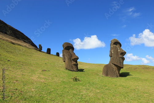 Siede shot of Two Moais Statues On Rano Raraku Volcano, Easter Island photo