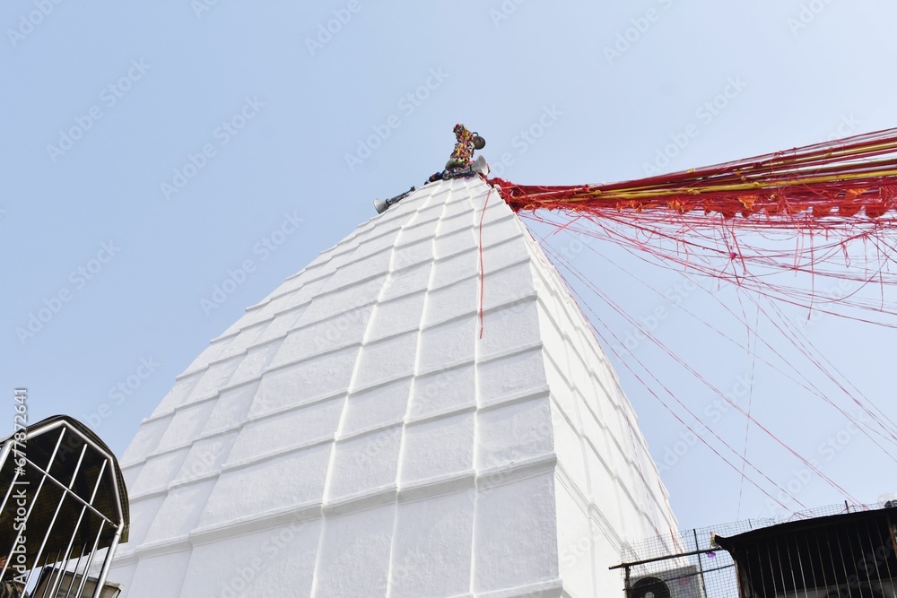 Fototapeta premium Low angle shot of a white building with red ribbons