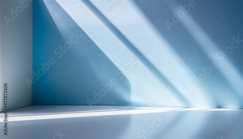 light minimalist geometric background image in gray and light blue tones with light and shadow from window for product presentation
