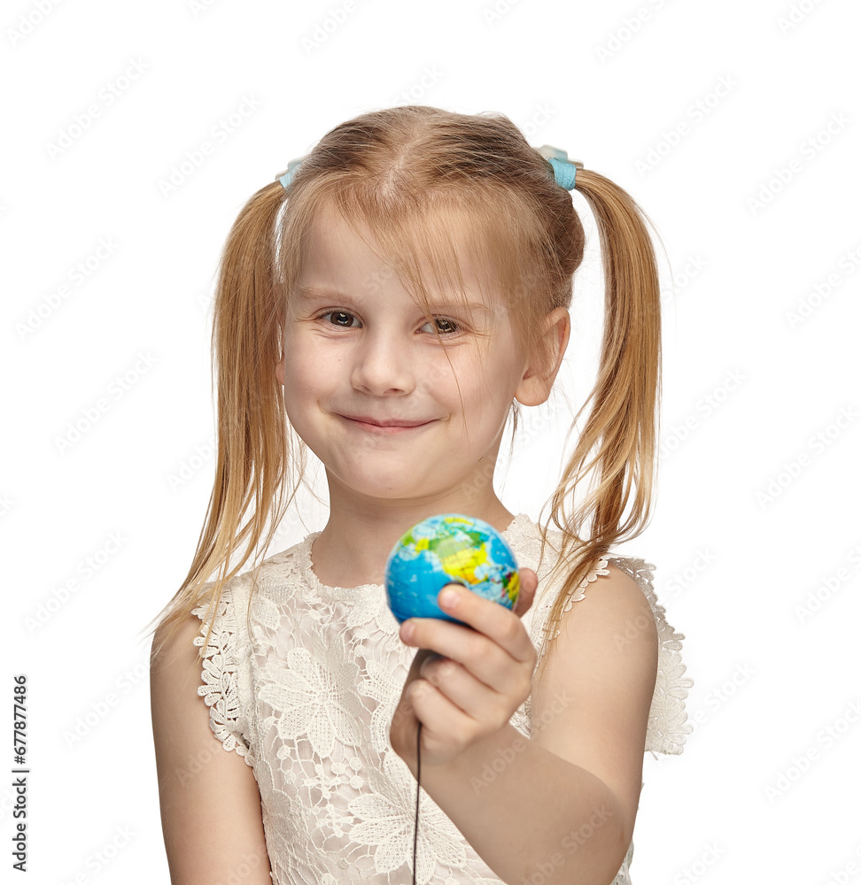 Blonde baby 6 years old, in a white dress shows a globe Blonde baby 6 years old, in a white dress shows a globe