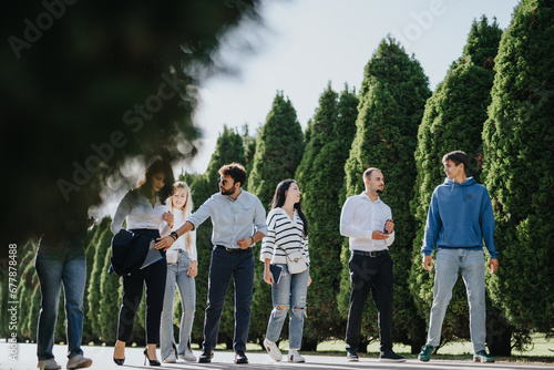 University students working on a project, discussing topics, and solving tasks in the park. They are studying, preparing for exams, and striving for better grades together.