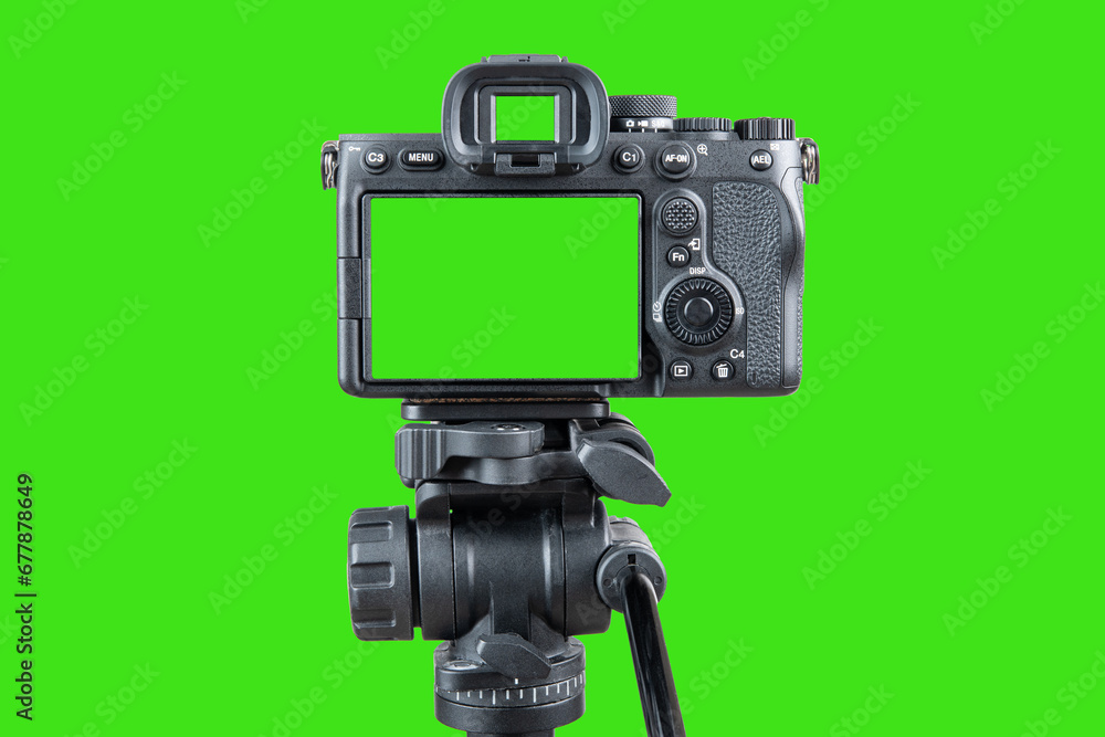 Photo camera. Digital or Dslr camera on tripod. Green screen or Chroma key. Photographer or videographer studio for recording film video project. Professional blogger, television equipment