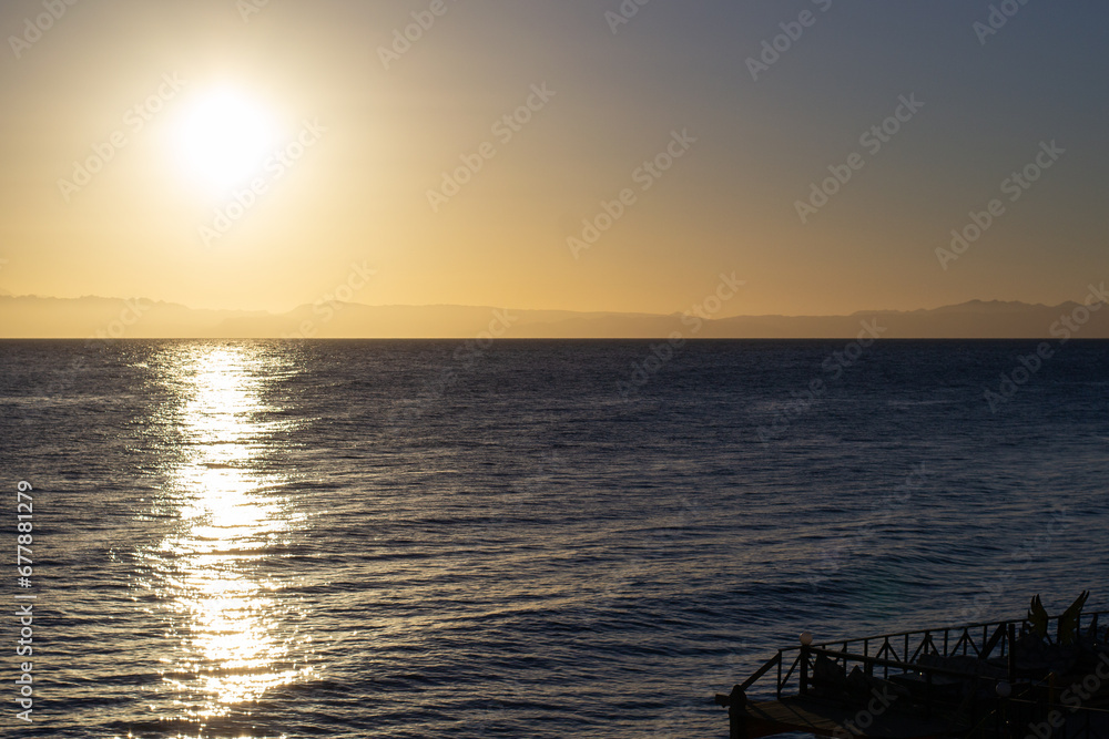 Beautiful view of a sea under the clear sky during sunset