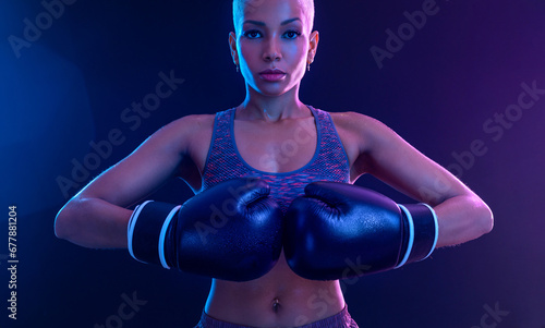 The Boxing. Brazilian woman boxer. Sportsman muay thai boxer fighting in gloves. Isolated on black background. Copy Space.