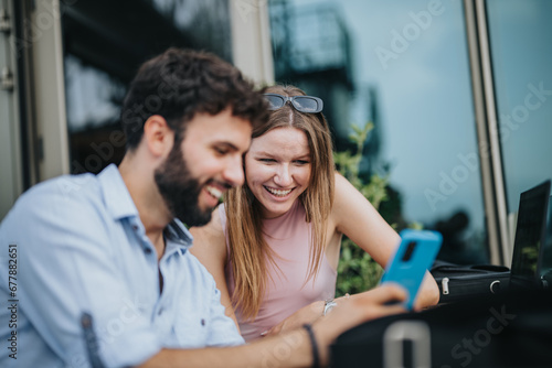 Young business couple discussing growth strategy and new projects over coffee in an urban cafe on a cloudy day. Planning for market expansion and increased profitability.