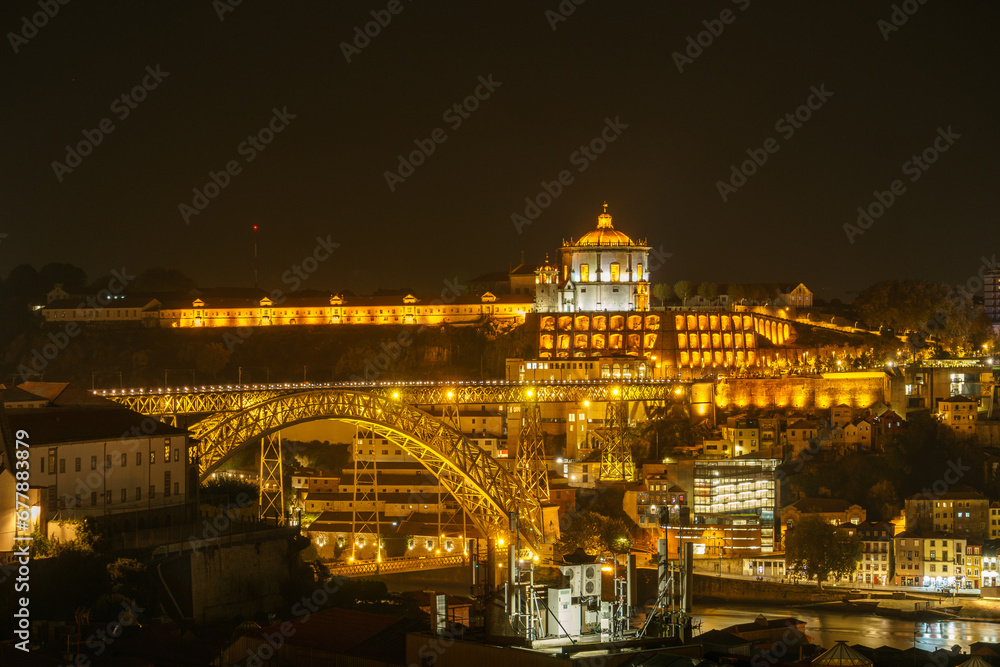 Night view over illuminated City Porto with Ponte Dom Luis Bridge and Monastery Serra do Pilar in Vila Nova de Gaia, Porto, Portugal