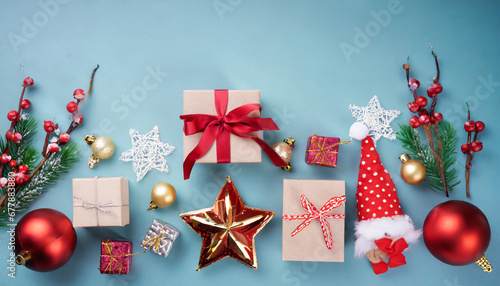 christmas collection gifts and decorative ornaments on blue background photographic montage