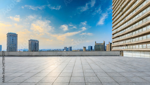 empty square floors and urban residential area buildings under the blue sky