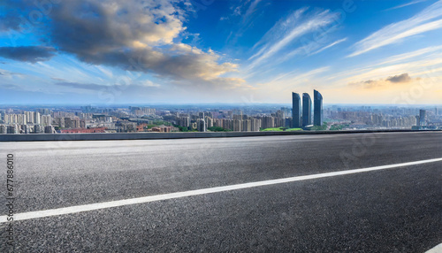 asphalt road and city skyline with modern buildings scenery
