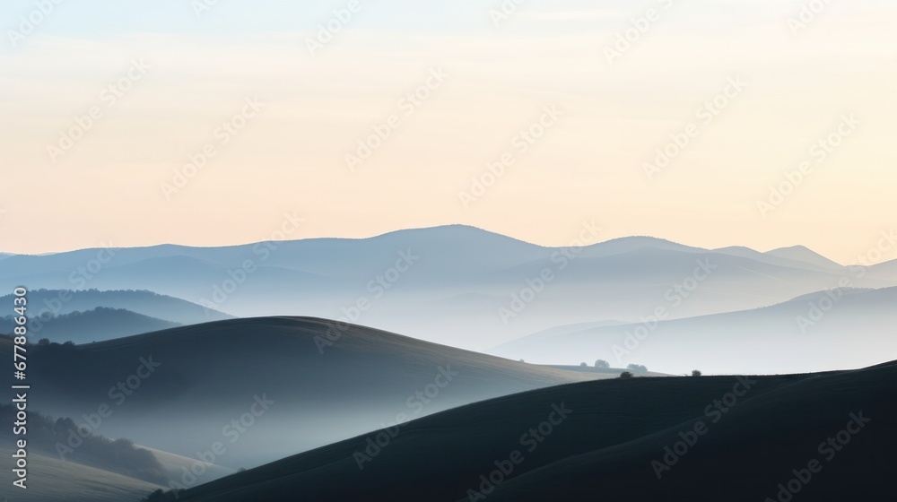A serene sunrise over misty mountains, creating a captivating view of nature's beauty.