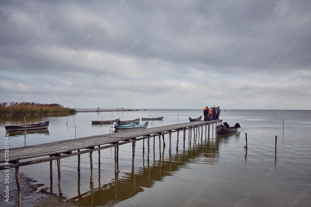 fishing boats at sunrise on the lake