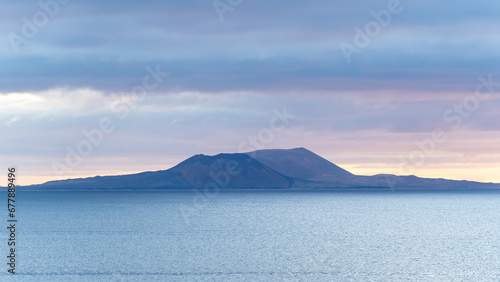 view at sunrise of la graciosa island,  volcanic island in the Canary, part of the Chinijo Archipelago photo