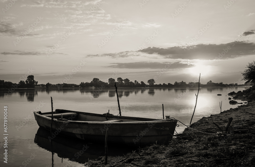 sunrise with boats on the lake