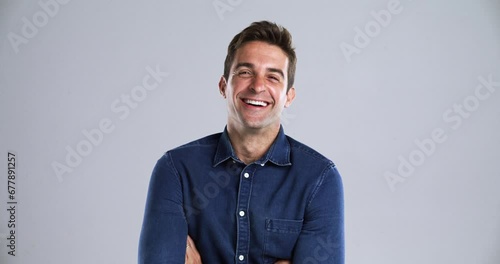 Man, face and laugh happy in studio grey background for comedy funny, joke meme or joy. Male person, model and portrait for emoji expression or silly goofy mood for playful, positive vibes as mockup photo