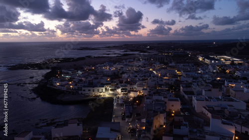 Panoramic view of El Cotillo bay, aerial high above point of view drone digital nomad night nightlife sunset sunrise dawn fuerteventura Spain