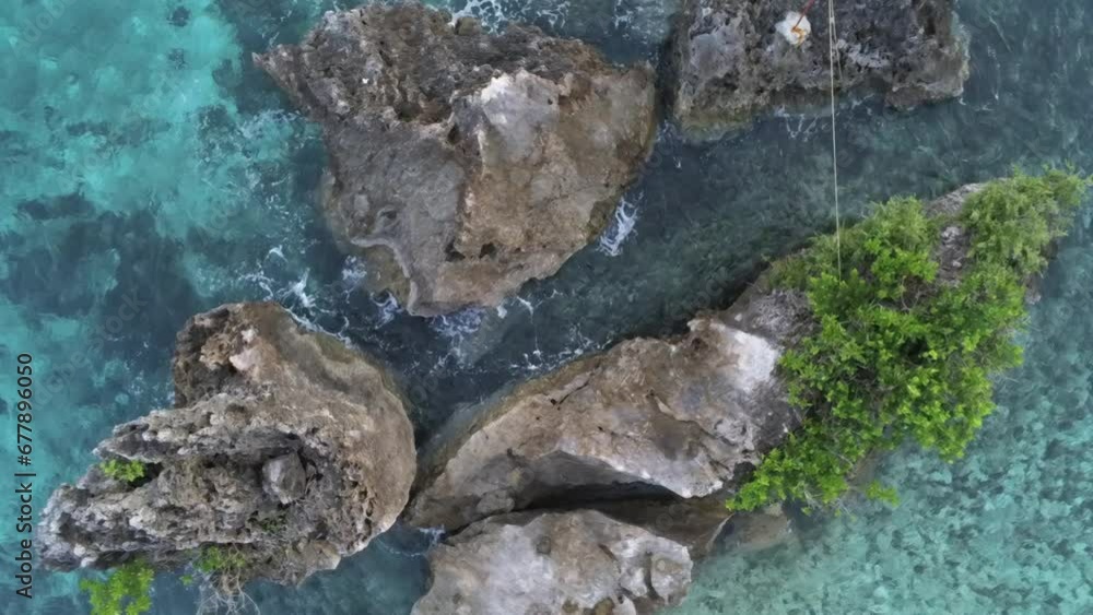 Aerial of a the sea rocks surrounded by shallow turquoise water Aerial of a the sea rocks surrounded by shallow turquoise water