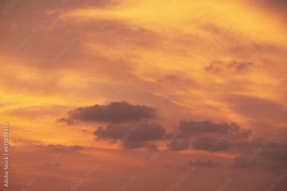 Red orange cloudy sky highlighted by Sunset, tropical Thailand. Close up photo.