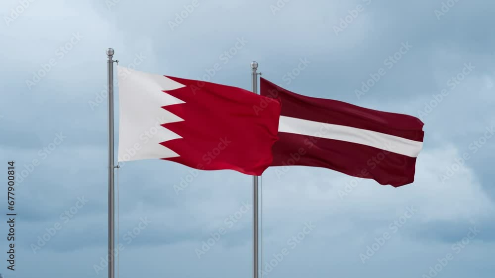Latvia and Bahrain flag waving together on cloudy sky, endless seamless loop, two country cooperation concept Latvia and Bahrain flag waving together on cloudy sky, endless seamless loop, two country cooperation concept
