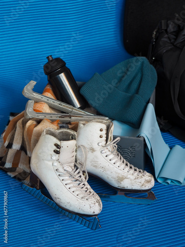 Old figure skating skates. Preparation for training. Figure skating equipment 
