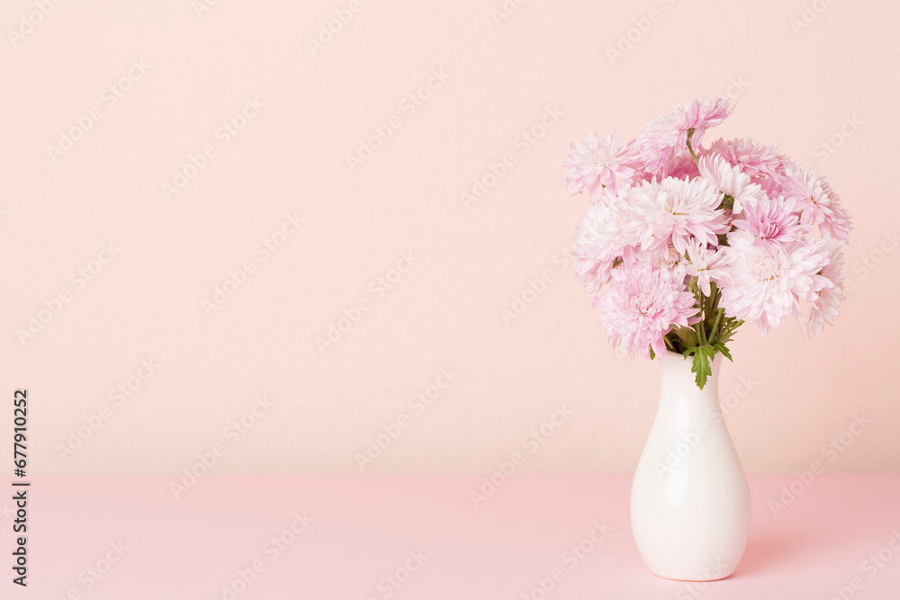 Vase with beautiful chrysanthemum flower bouquet on color background Vase with beautiful chrysanthemum flower bouquet on color background