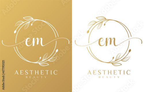 Letter EM Beauty Logo with Flourish Ornament