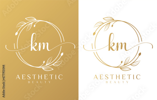 Letter KM Beauty Logo with Flourish Ornament