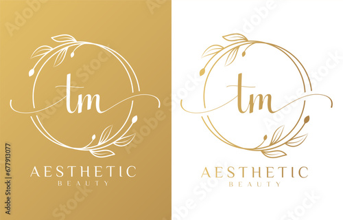 Letter TM Beauty Logo with Flourish Ornament