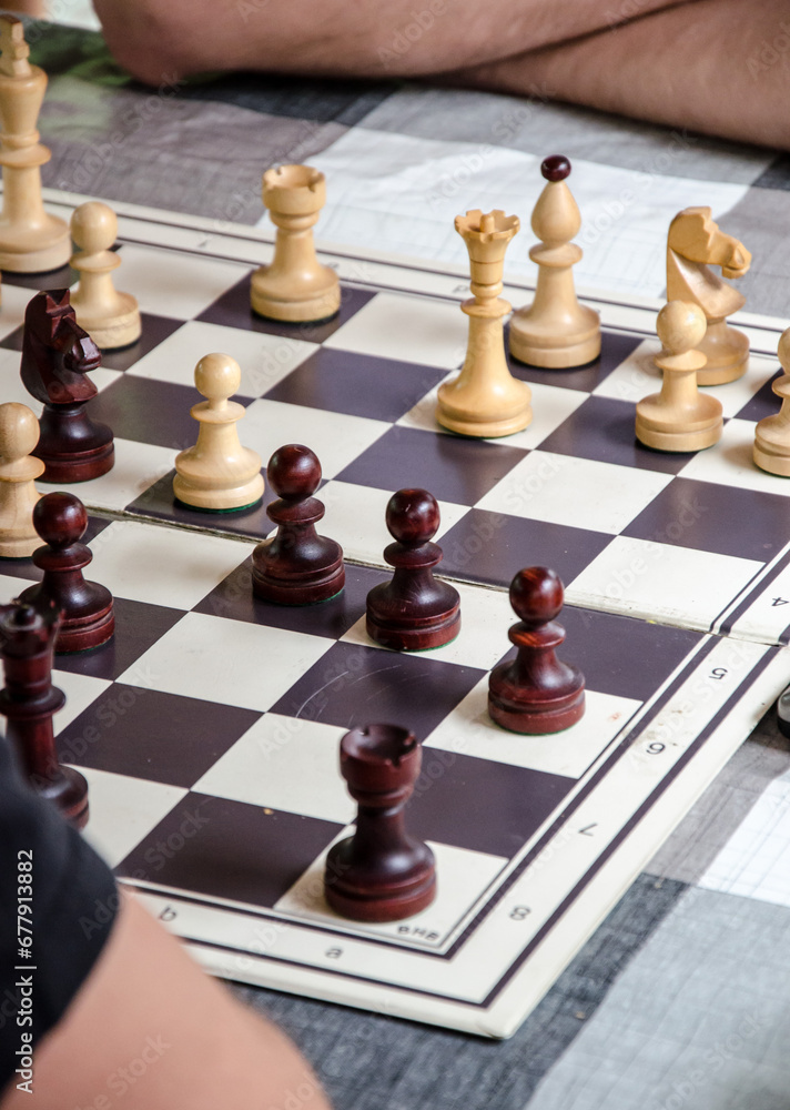 Two men playing chess. Chess pieces on the board. Two men playing chess. Chess pieces on the board.
