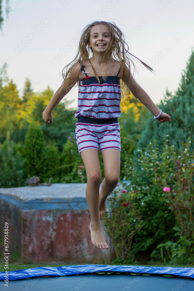 A girl Jumping on trampoline