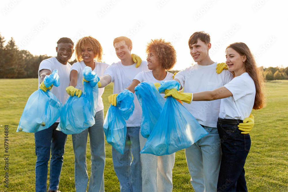 multiracial group of people volunteers in gloves with garbage bags collect garbage and plastic in the park multiracial group of people volunteers in gloves with garbage bags collect garbage and plastic in the park
