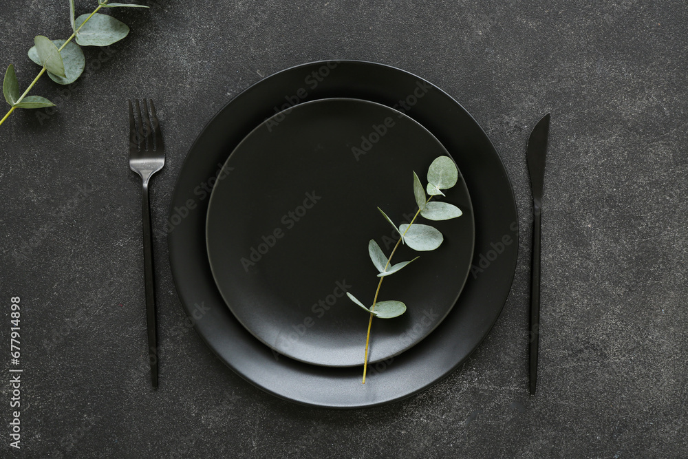 Naklejka premium Stylish table setting on black background