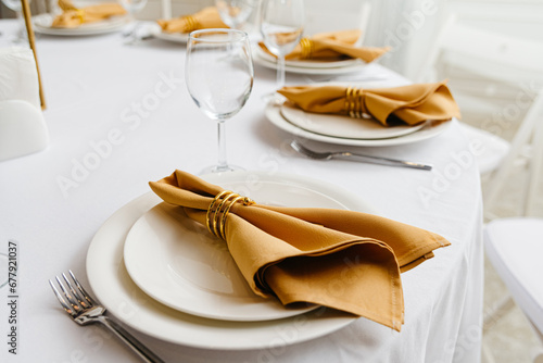 Photos Elegance and Simplicity: A White Table Set With Minimalistic White Plates and Sh