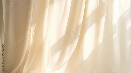 A minimalistic abstract background showcasing a pale yellow light softly pouring through a curtain onto a textured linen fabric. The delicate shadows create a serene photo