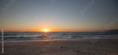 Sun setting into the ocean at Port Hueneme California United States