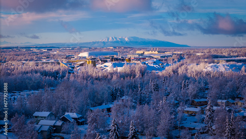 Sleeping Lady Mountain over an Arctic Snowy City