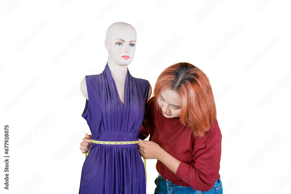Fashion designer measuring waist of mannequin in a white background Fashion designer measuring waist of mannequin in a white background